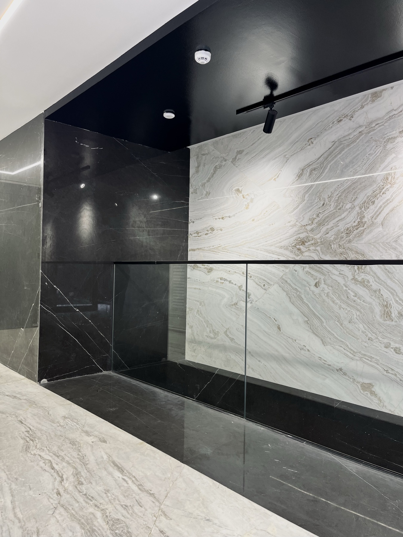 Book-matched and dark marble wall cladding